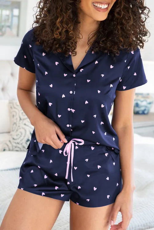 Pijama con corazónes y listón rosa